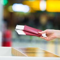 Closeup passports and boarding pass at airport indoor photo