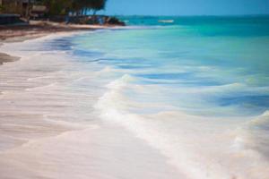 Idyllic perfect turquoise water at exotic island photo