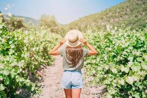 Woman in the vineyard in sun day photo