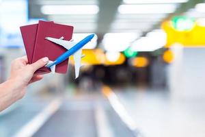 Closeup passports and boarding pass at airport indoor photo