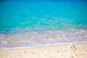 Turquiose water and white sand on one of the european beaches photo