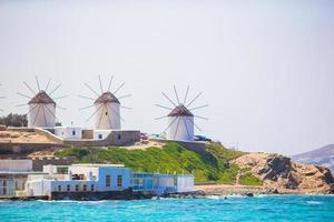 Famous view of traditional greek windmills on Mykonos island at sunrise, Cyclades, Greece photo