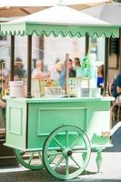 Shiny mint colorful ice cream cart outdoors photo