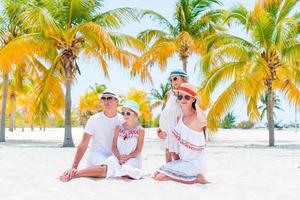 Young family of four on summer vacation photo