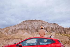 Happy woman on summer vacation in famous place. Cave formations. photo