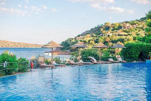 Beautiful luxury landscape around pool in hotel resort photo