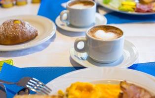 Delicious and tasty cappuccino for breakfast at a cafe photo