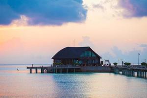 Beautiful colorful sunset in tropical island at Maldives photo