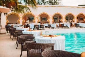 Summer empty open air luxury restaraunt at exotic hotel photo