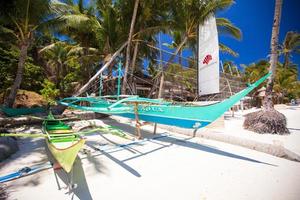 Boat at the beauty beach with turquoise water photo