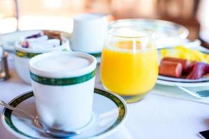 Healthy breakfast with fresh juice and sweet croissant in restaraunt resort outdoor photo