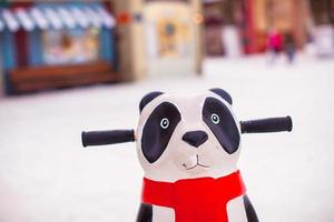 Panda for helping little skaters to teach skate on ice photo