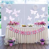 Wedding white banquet tables prepared for celebration photo