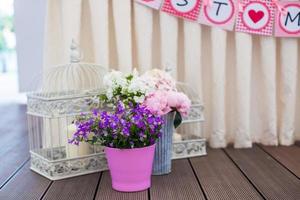 Beautiful bright bouquet in vase on the floor photo