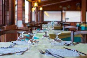 Served table set at restaraunt in the evening photo