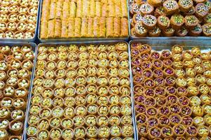 Traditional tasty Turkish sweets on the market photo