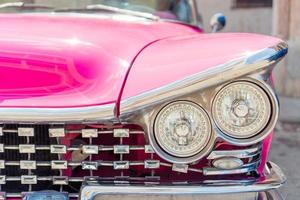 View of yellow classic vintage car in Old Havana, Cuba photo