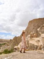 Young woman touring cave church in Cappadocia photo