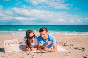 Young couple spending time together on the beach photo