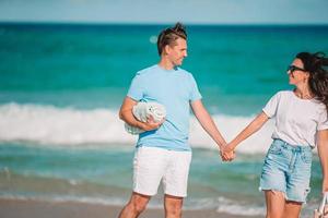 Young couple spending time together on the beach photo