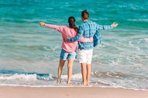 Young couple spending time together on the beach photo