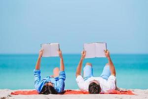 Young couple on white beach during summer vacation. photo