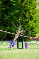 Halloween accessories hat, broom, candle, garlic and flashlights photo