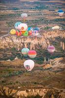 GOREME, TURKEY - SEPTEMBER 18. 2021, Bright hot air balloons in sky of Cappadocia, Turkey photo