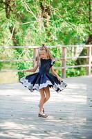 Adorable little school girl have fun outdoor. Back to school. photo