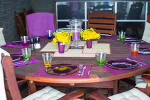 Beautiful home served table for dinner on the veranda photo