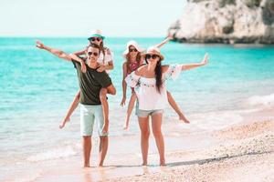 Photo of happy family having fun on the beach. Summer Lifestyle