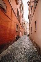 Old beautiful empty narrow streets in small city of Lucca in Italy photo