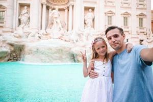 Happy kid and dad enjoy their european vacation in Italy photo