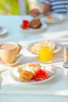 Healthy breakfast on the table in outdoor cafe photo