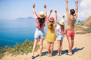 Young family on summer vacation with view from mountains photo