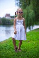 Beautiful happy girl walking outdoor near the lake photo