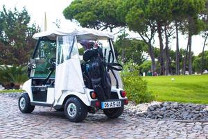 Golf cart on the road in golf-club photo