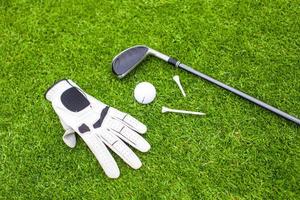 Golf equipment on green grass photo