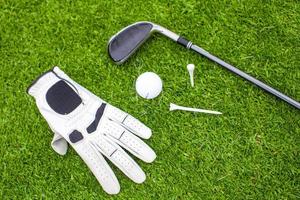 Golf equipment on green grass photo
