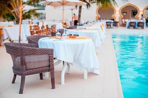 Summer empty open air luxury restaraunt at exotic hotel photo