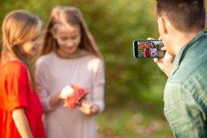 Little adorable girls outdoors at warm sunny autumn day photo