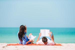 Young couple on white beach during summer vacation. photo