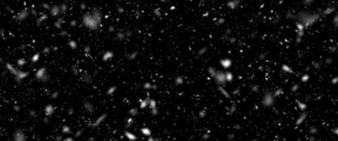 Snowfall bokeh on black background. Many snowflakes in flying in the air. Winte night snowfall and blizzard of snow at. Blur bokeh light effect creative background. photo