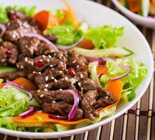 Salad with beef teriyaki photo