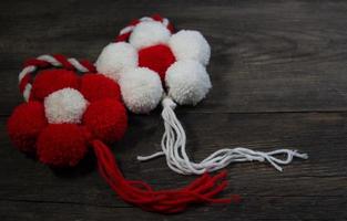 a martisor of flowers with wool pompoms photo