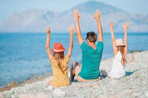 Happy beautiful family on a tropical beach vacation photo