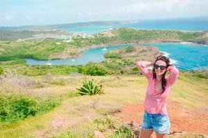 Young woman enjoying breathtaking views of beautiful landscape photo