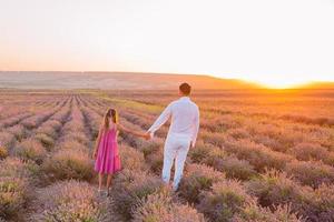 Family of two in lavender flowers field photo