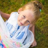 Adorable little girl happy outdoor at summer time photo