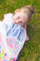 Adorable little girl happy outdoor at summer time photo